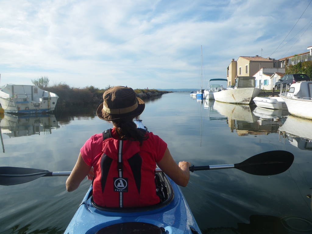 Glassy water leading toward Étang de Thau  from the Mediterranean